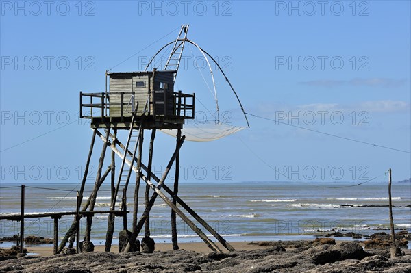 Traditional carrelet fishing hut with lift net on the beach at Saint-Michel-Chef-Chef