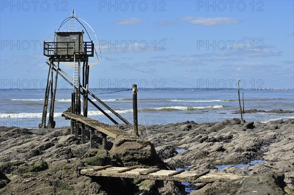 Traditional carrelet fishing hut with lift net on the beach at Saint-Michel-Chef-Chef