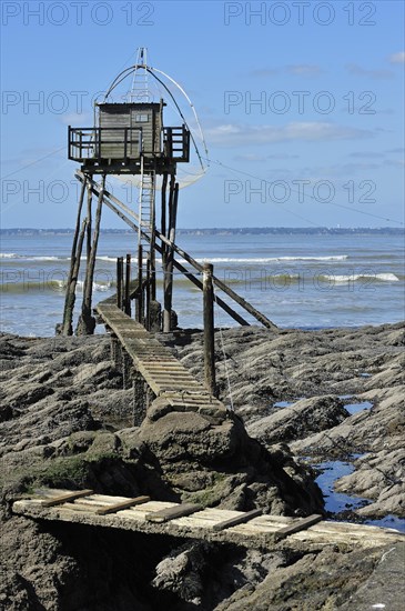 Traditional carrelet fishing hut with lift net on the beach at Saint-Michel-Chef-Chef