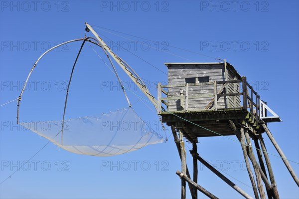 Traditional carrelet fishing hut with lift net on the beach at Saint-Michel-Chef-Chef