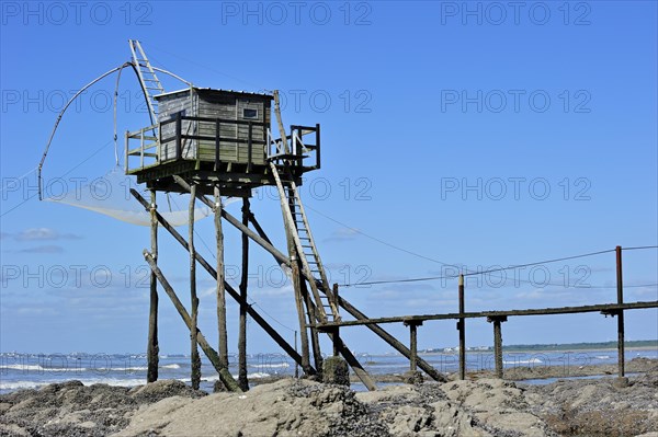 Traditional carrelet fishing hut with lift net on the beach at Saint-Michel-Chef-Chef