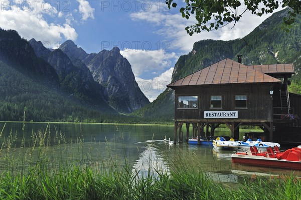 Restaurant and pedal boats along the lake Lago di Dobbiaco