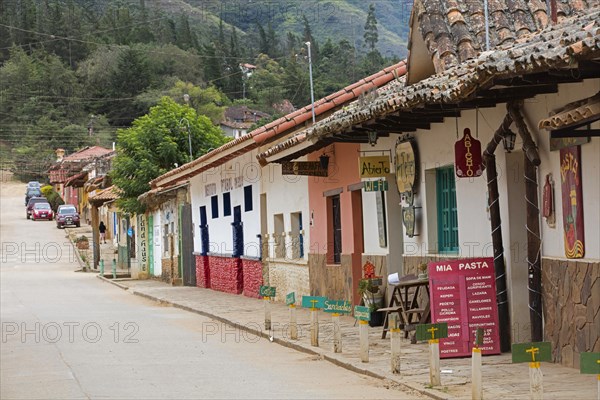 Street with shops and cafe offering wifi in the town Samaipata