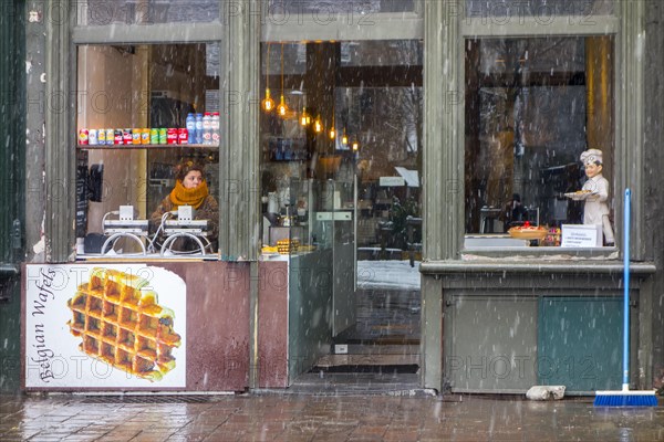 Vendor of Belgian waffles waiting for customers