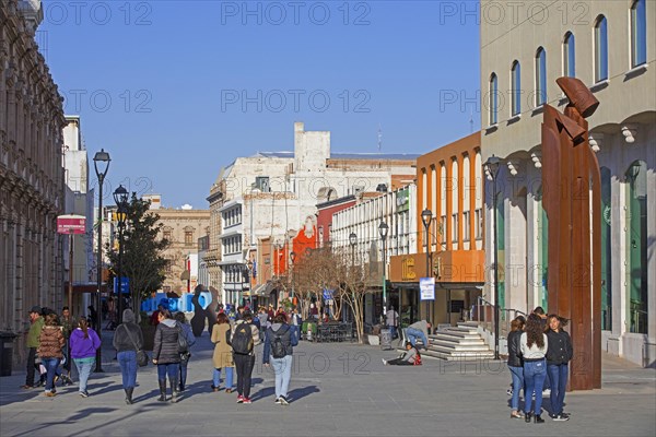 Mexicans walking in main shopping street in the city centre of Chihuahua