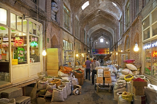 Large bags with spices for sale in the old historic bazaar of the city Tabriz