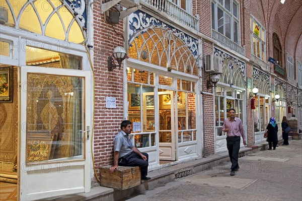 Antiques and carpets for sale in shops in the old historic bazaar of the city Tabriz