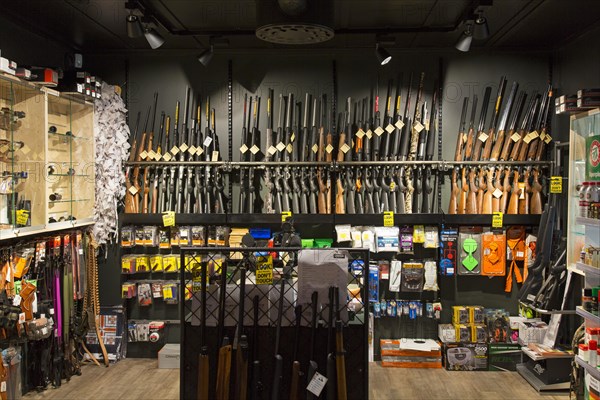 Interior of gunstore selling rifles