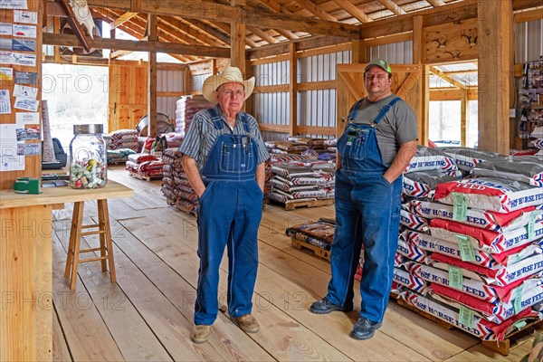 Two Texan farmers wearing dungarees