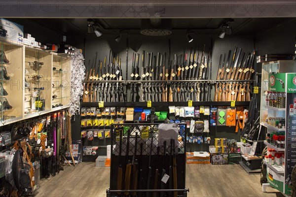 Interior of gunstore selling rifles