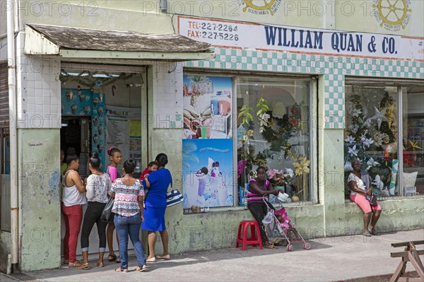 Local women buying refreshments at ice-cream parlour in Belize City