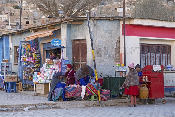 Bolivian street vendors and little shop in the village Atocha in the Andes