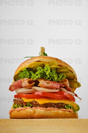 Low angle view of beef burger with bacon