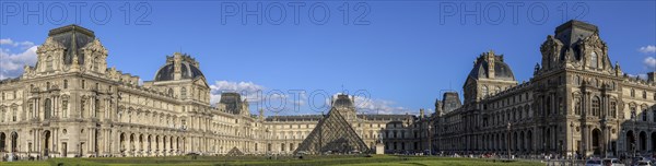 Panoramic photo of the Louvre Museum building and the glass pyramid