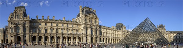 Panoramic photo of the Louvre Museum building and the glass pyramid