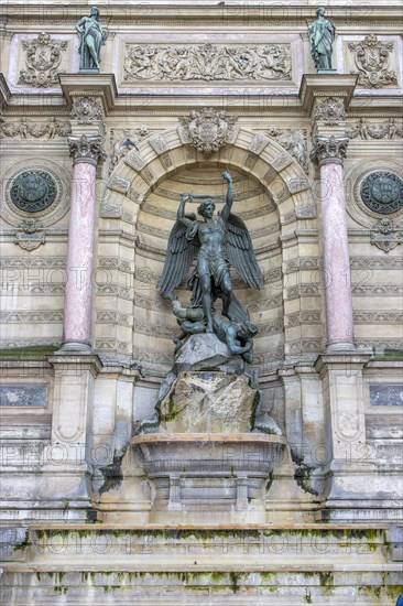 Bronze statue of the fountain La Fontaine Saint Michel