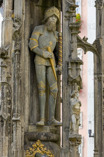 Detail with the portrait of the prince sculpture on the Gothic fountain column of the market fountain on the market square