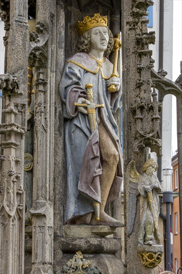 Detail with the portrait of the prince sculpture on the Gothic fountain column of the market fountain on the market square