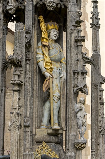 Detail with the portrait of the prince sculpture on the Gothic fountain column of the market fountain on the market square