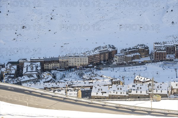 Aerial view of El Pas de la Casa in the snowy landscape in the Pyrenees mountains in Andorra