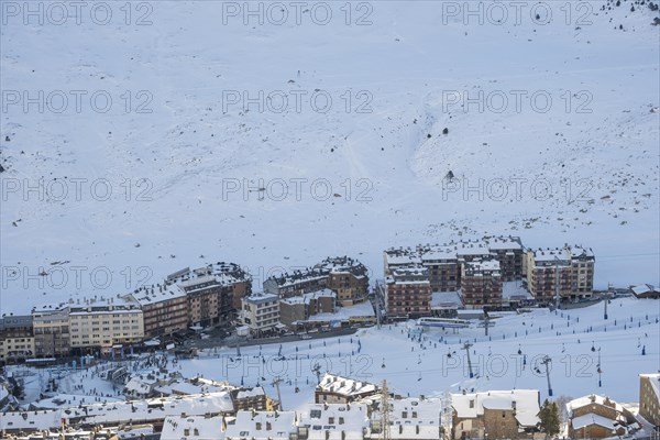 Aerial view of El Pas de la Casa in the snowy landscape in the Pyrenees mountains in Andorra