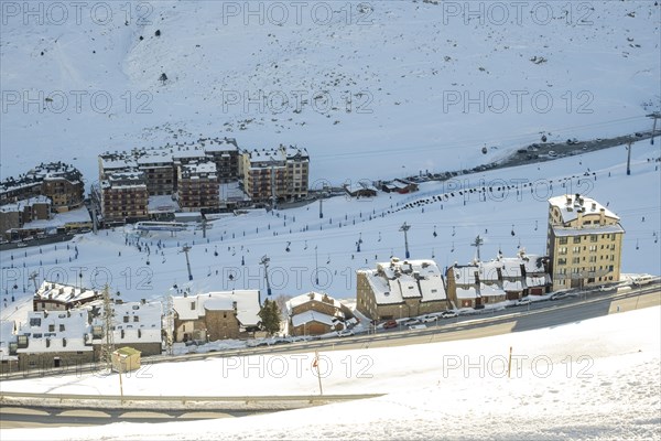 Aerial view of El Pas de la Casa in the snowy landscape in the Pyrenees mountains in Andorra