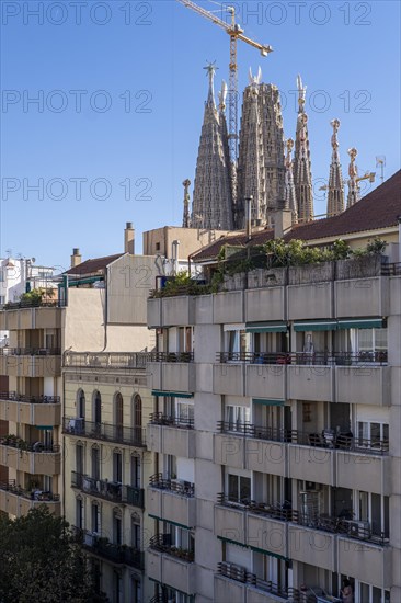 View of the Sagrada Familia and neighborhood buildings in Barcelona Spain