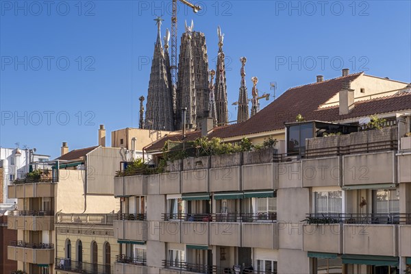 View of the Sagrada Familia and neighborhood buildings in Barcelona Spain