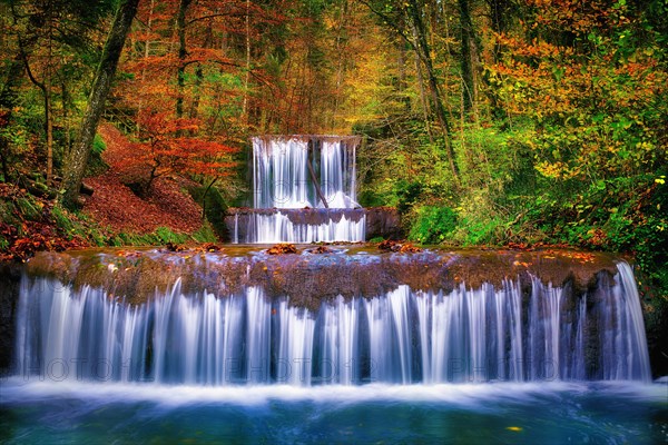 Village stream with waterfalls