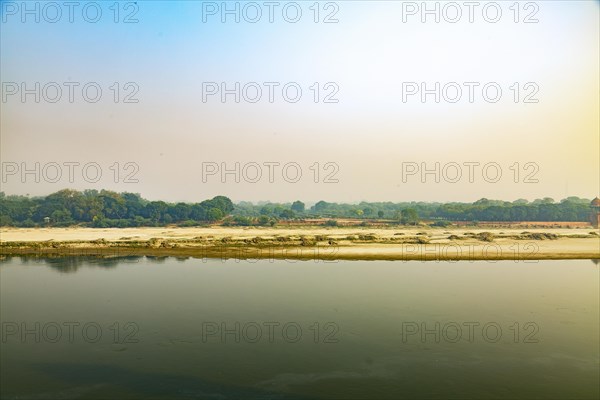 Yamuna river flowing behind Taj mahal building in Agra