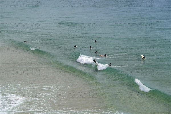 Surfers in the surf at Sagres beach