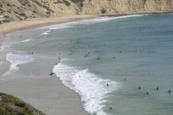 Surfers in the surf at Sagres beach