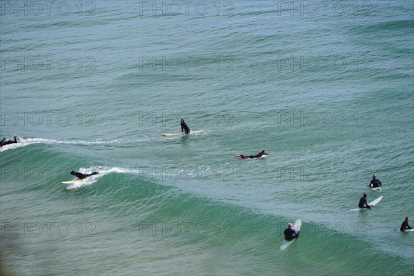 Surfers in the surf at Sagres beach