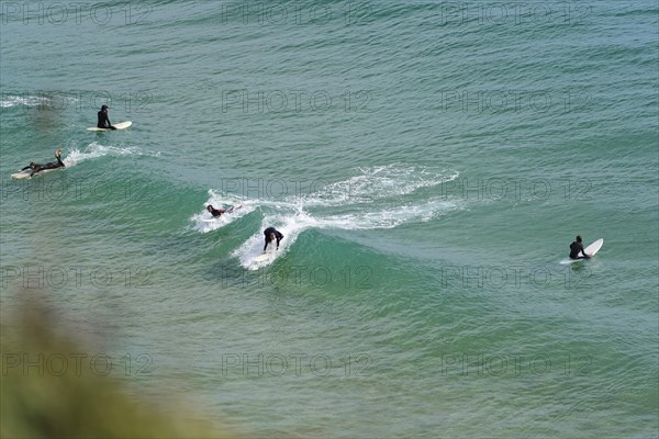 Surfers in the surf at Sagres beach