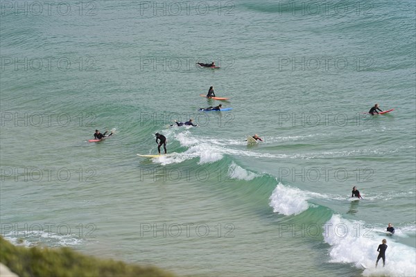 Surfers in the surf at Sagres beach