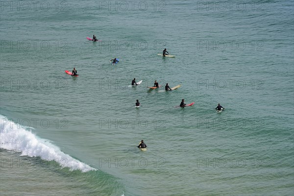 Surfers in the surf at Sagres beach