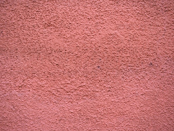 Red plaster wall background