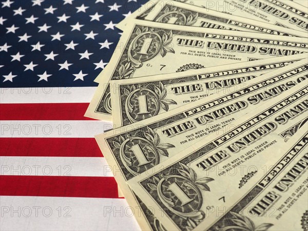 Dollar notes and flag of the United States