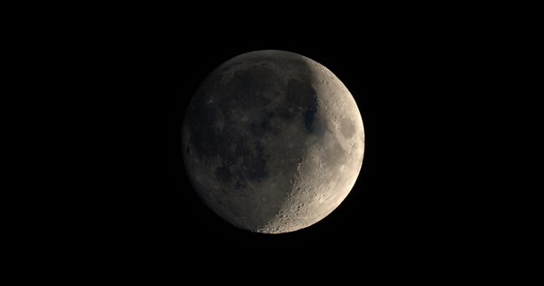 Waxing crescent moon seen with telescope