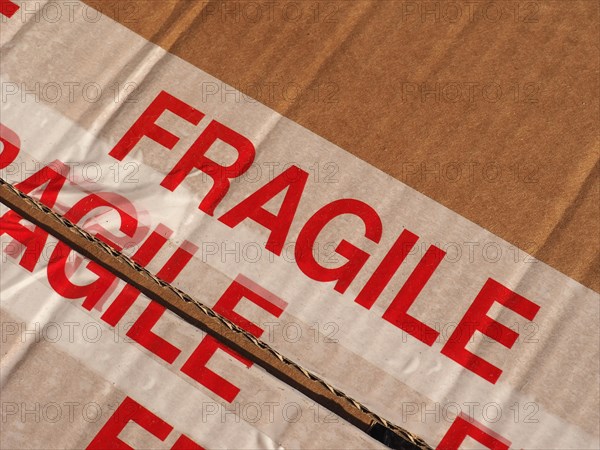 Fragile on cardboard packet