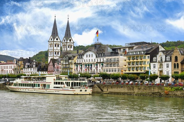 Tourist boat anchored in front of St. Severus Church