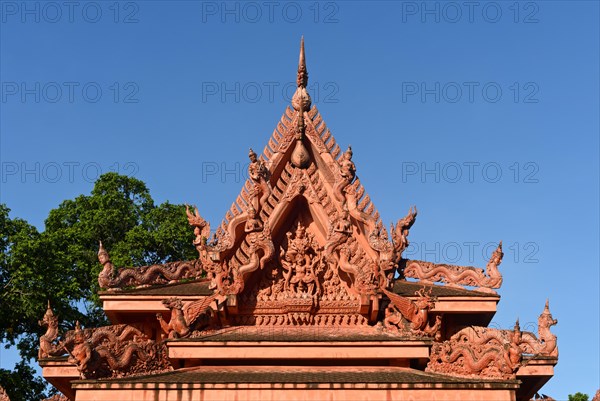 Pediment of the Buddhist Wat Sila Ngu temple with figurative decorations from Buddhist mythology