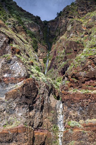 Volcanic cliff with waterfall
