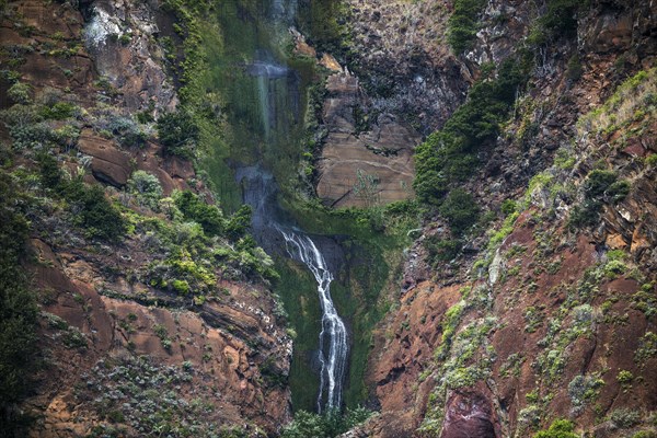 Volcanic cliff with waterfall