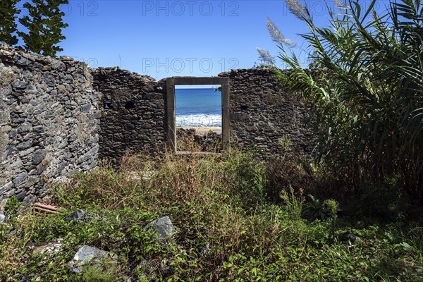 Crumbling wall with window frame