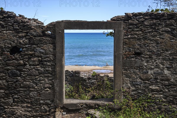 Crumbling wall with window frame