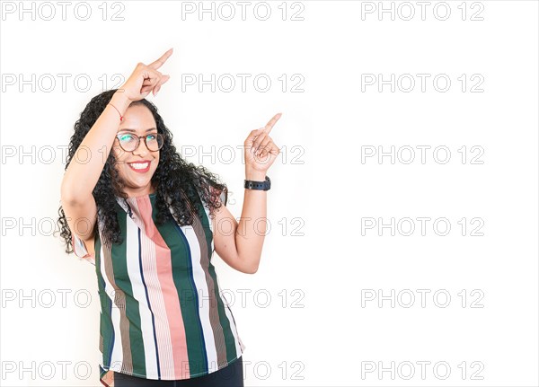 Happy afro young woman pointing an advertising side. Beautiful afro girl pointing to a banner to the side. Happy people pointing a promo isolated