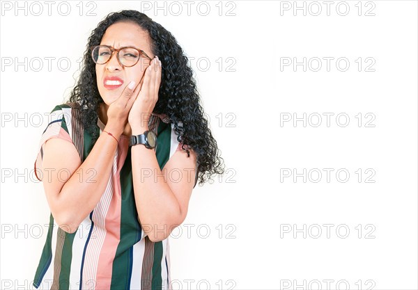 Young afro woman suffering with toothache isolated. Afro girl rubbing cheek with toothache on white background