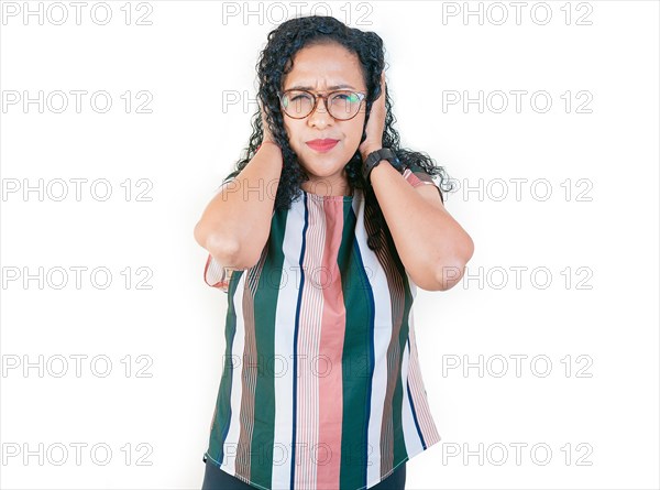 Displeased afro girl in glasses covering her ears isolated. Young afro woman covering her ears tightly