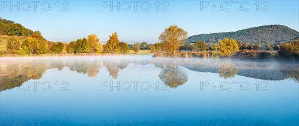 Lake with morning mist in autumn